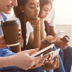 Teenagers using their smartphones