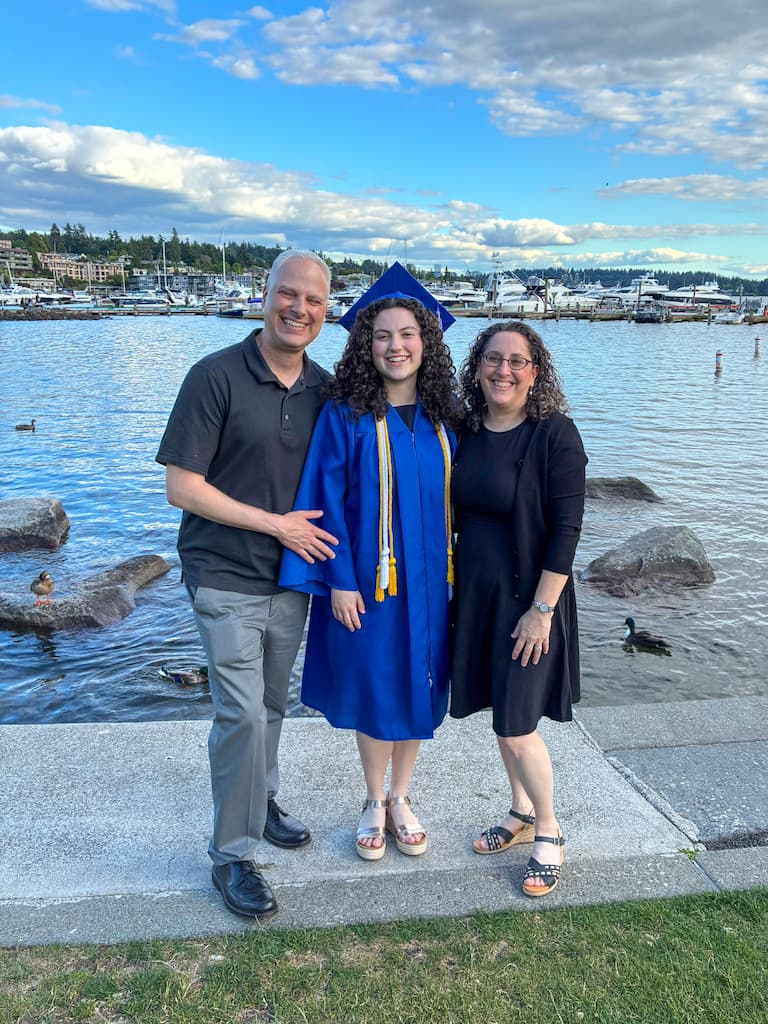 Shoshanna in cap and gown with parents